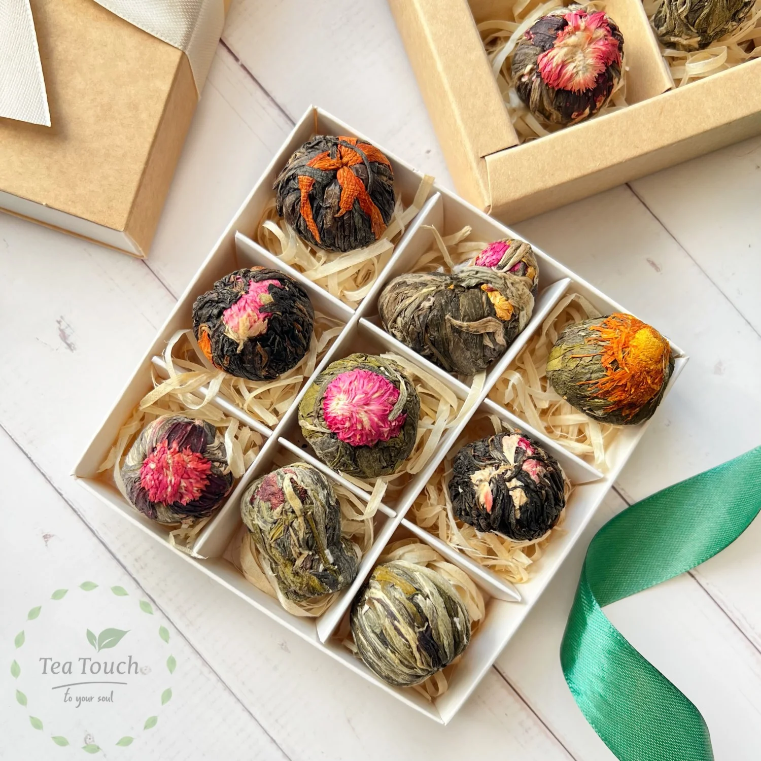 Large gift box of sixteen assorted flowering teas tied with a yellow ribbon