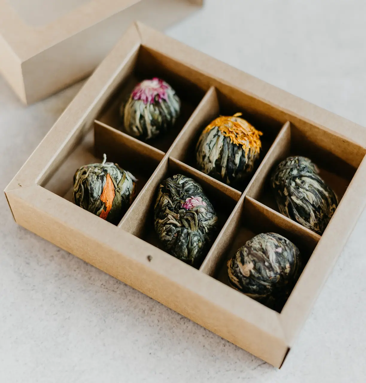 Tasting set of glass tubes with corked tops holding different loose teas